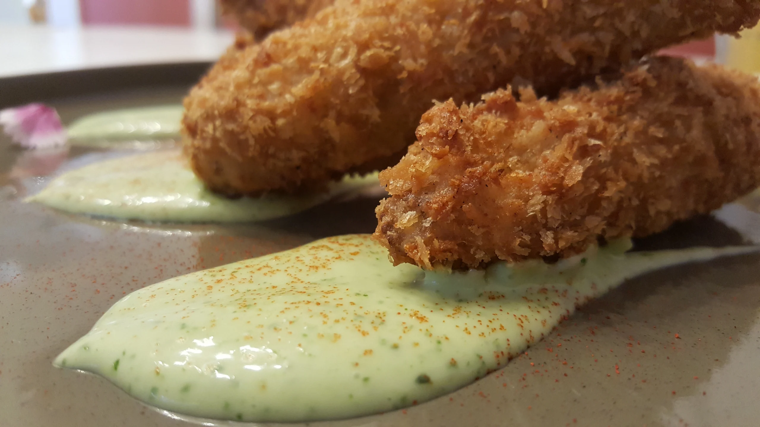 Fried baby corn served with a sauce