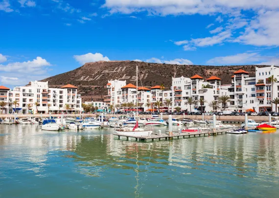 A scenic view of an Atlantic coastal city in Morocco, with a bustling medina and azure waters.