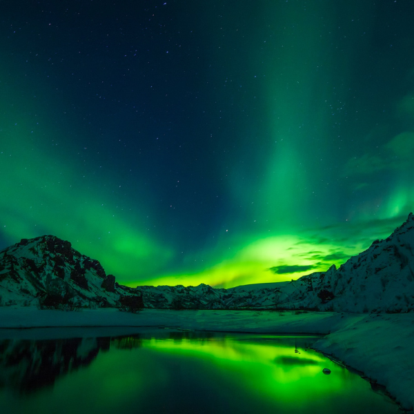 Northern lights and its reflects in the water body.
